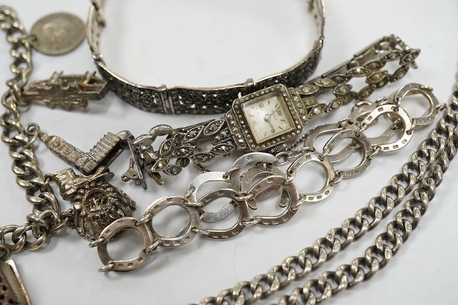 Two silver bracelets, a silver watch chain, a silver and marcasite bracelet and a similar watch. Condition - fair